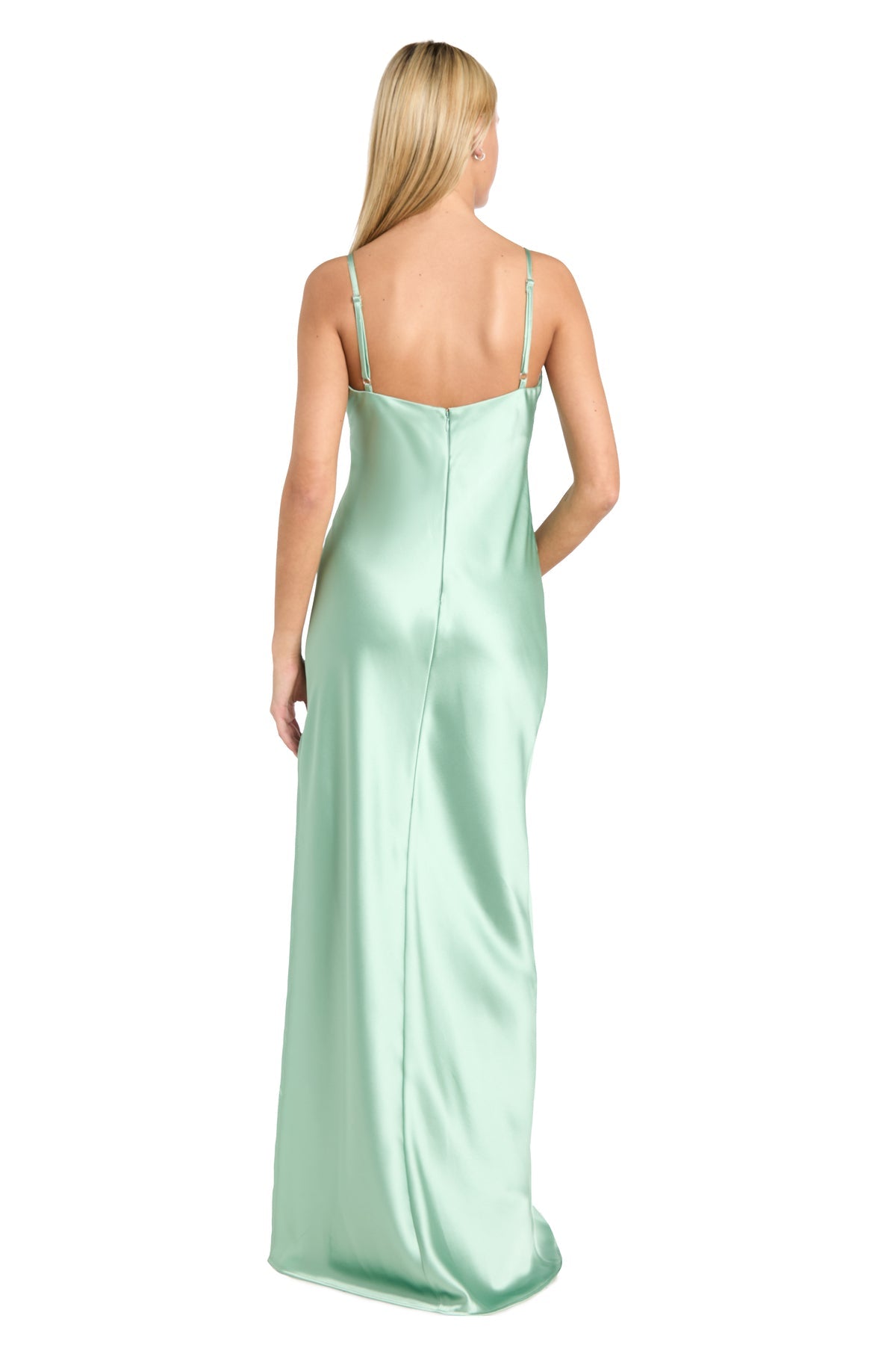 A woman with long blonde hair wears the affordable Morgan 10040N Empire-Waist Long Satin Prom Dress—a light green sleeveless gown with thin straps and an elegant back view.